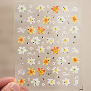 5D embossed lily flower nail sticker detail shot with silver foil stars and elegant floral patterns.
