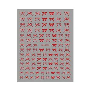 Red bow nail sticker sheet detail, cute adhesive nail art designs for manicure decoration.