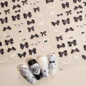 5D relief nail art stickers with black bows and pearls, perfect for DIY nail design.