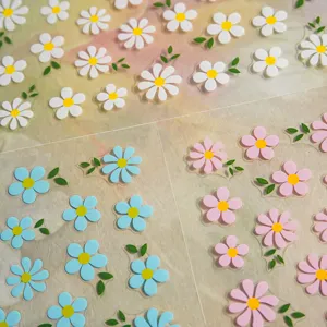 Redanco 3D floral nail stickers featuring white, blue and pink daisy designs with cute leaves.