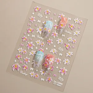 Close-up detail of 5D embossed lily nail stickers with shiny silver foil and flower design.