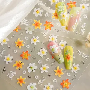 5D embossed lily nail art stickers with silver foil star and pearl details for trendy manicure.