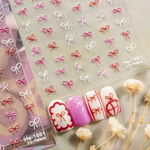 5D embossed nail art stickers featuring cute white pink red bows for stunning manicure designs.