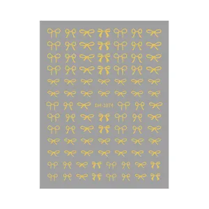 Gold bowknot 3D nail art stickers sheet detail view featuring elegant bow designs for manicures.
