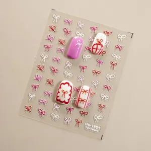 5D embossed bow nail sticker detail showing delicate white and red bow decals on transparent sheet.