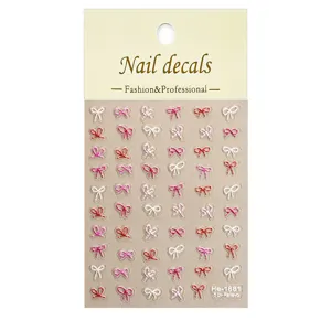 Close up of 5D embossed bow nail decals, delicate ribbon nail art sticker sheet details.