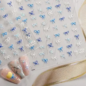 5D embossed blue white bow nail art sticker detail view, elegant DIY manicure accessory.