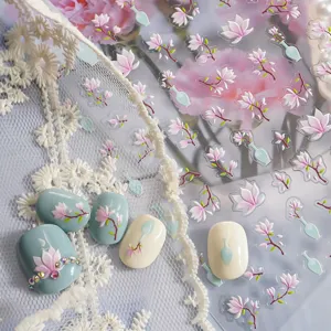 Closeup of 5D embossed Chinese style nail stickers featuring magnolia and vase motifs.
