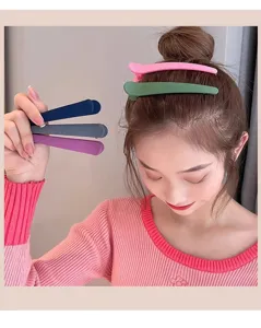 Detail view of matte duckbill hair clips in various colors, perfect for daily styling setup.