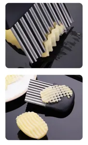 Stainless steel potato crinkle cutter detail shot, showing wave slicing effect for french fries.