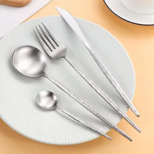 Creative 304 stainless steel tableware set, including knife, fork and spoons with bark texture.