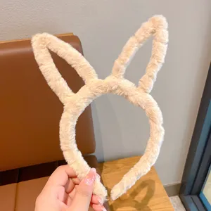 Fluffy plush rabbit ear headband for cute girls, soft autumn winter hair hoop accessory.