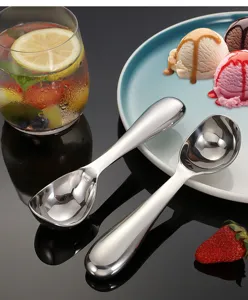 Stainless steel ice cream spoon detail view, elegant design for scooping desserts and fruits easily.