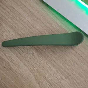 Large matte duckbill hair clip for women, minimalist styling hair accessory in green color.