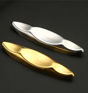 Stainless steel boat-shaped chopstick rest set, gold and silver creative table tableware holder detail view.