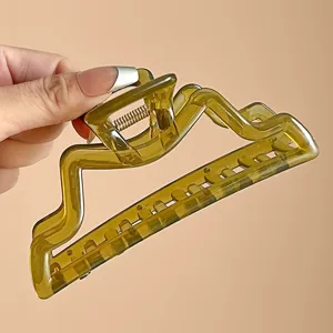 Grande molletta per capelli 13cm, elegante design geometrico ondulato, pinza in acetato verde.