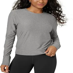 Detailed view of women grey long sleeve crewneck top, slim fit workout fitness activewear