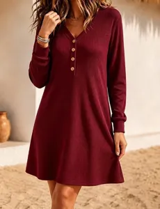 Close-up of the long sleeve ribbed knit dress featuring front buttons and V-neck detail.