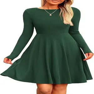 Detailed view of the dark green ribbed knit long sleeve flare mini dress showing texture.