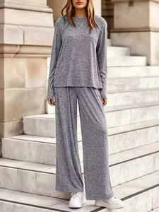 Casual grey ribbed knit two-piece set featuring a long-sleeve top and wide pants.