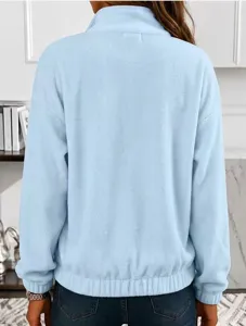 Back detail view of light blue fleece loose lapel pullover long sleeve sweatshirt fabric