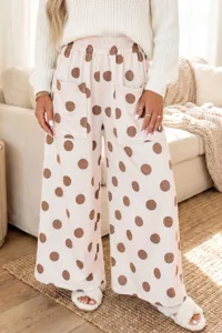 Women's loose casual polka dot wide leg pants with large pockets and elastic waist.