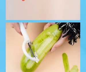 Gemüseschäler Detailaufnahme mit rostfreier Klinge und ergonomischem weißem Griff im Einsatz.