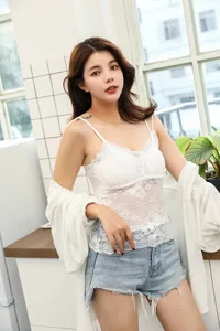 Detailed view of white lace camisole with built-in chest pads, elegant and comfortable.