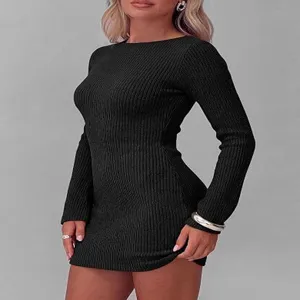 Close-up detail of the elegant black long sleeve ribbed knit mini dress, slim fit style.