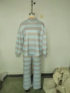 Detailed view of grey striped loungewear set featuring high collar top and trousers.