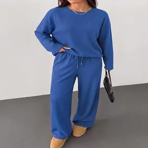 Detail view of women casual long sleeve crewneck top and wide leg pants loungewear set.