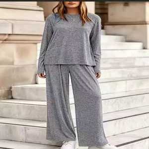Grey ribbed knit two-piece set detail view, featuring a loose long-sleeve top and wide-leg pants.