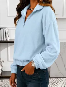 Women's light blue fleece quarter zip sweatshirt detail, cozy long sleeve lapel pullover top.