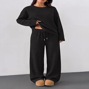 Casual black long sleeve crewneck top and wide leg pants set for women cozy outfit detail.