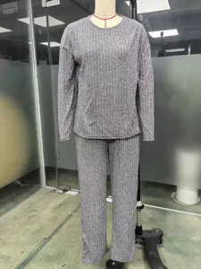 Casual grey ribbed knit two-piece set featuring a comfortable loose crewneck top and long pants.