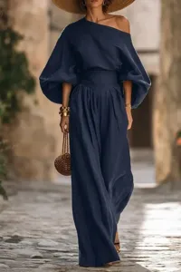 Elegant dark blue off-shoulder top and wide-leg pants set, chic resort style fashion wear.