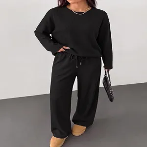 Casual black long sleeve top and wide leg pants comfort loungewear set detail view.
