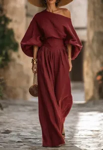 Stylish burgundy off-the-shoulder top and high-waist wide-leg pants set for women.