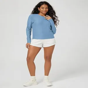 Detailed full-body view of women's solid long sleeve crewneck top styled for casual wear.