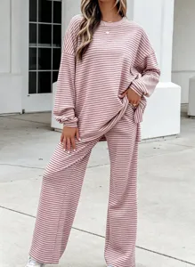 Striped knit pajama set with long sleeve top and wide leg pants for cozy casual home wear.