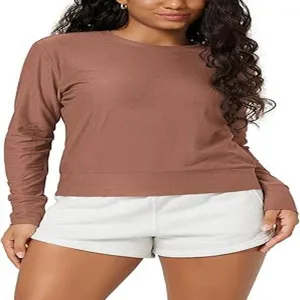 Close-up detail of the women's solid color long sleeve crewneck top showing fitted silhouette.