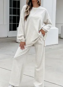 Detailed view of the cozy beige striped knit loungewear set featuring a relaxed long-sleeve top.