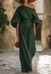 Detailed view of the elegant dark green off-the-shoulder top and wide-leg trousers outfit.