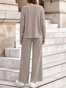 Ribbed knit two piece set detail featuring cozy long sleeve top and stylish wide leg pants.