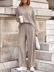 Detail view of the stylish casual ribbed knit two piece set worn by model outdoors.