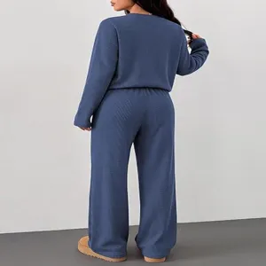 Back view detail of women solid color casual lounge set featuring long sleeve top and loose pants.
