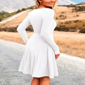 Details of the solid color long sleeve round neck dress, showing the elegant silhouette style.