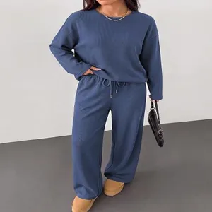 Detailed view of women casual loungewear set long sleeve top and wide leg pants comfort