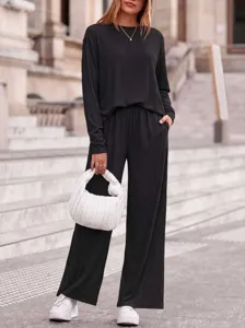Women casual ribbed knit two-piece set autumn long sleeve top and wide leg pants for daily wear.