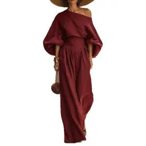Stylish women's wine red off-shoulder top and high-waist wide-leg pants two piece set.